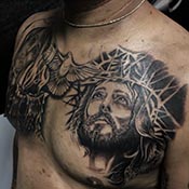 Black and grey chest Christ tattoo with Dove in middle