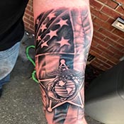 United States Marine Corp Symbol US flag half sleeve in black and grey tattoo