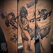 Girl riding a bomb with USMC tattoo