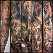 full sleeve tattoo in black and grey with faces