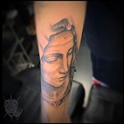 saint tattoo in black and grey
