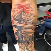 Japanese temple on half sleeve in color tattoo